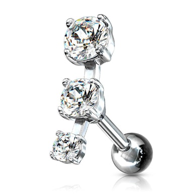 Piercing all'orecchio con tre pietre in fila