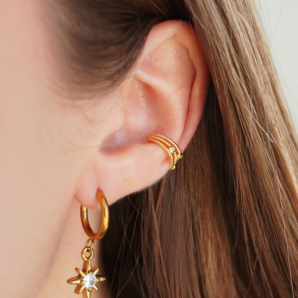 Ear cuff triplo dal design intrecciato e tre pietre