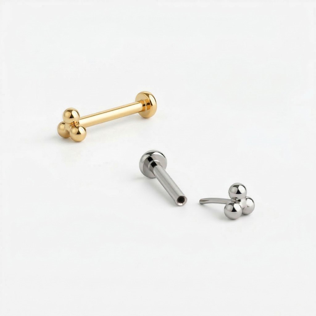 Labret push-in in titanio con top di sfere a triangolo