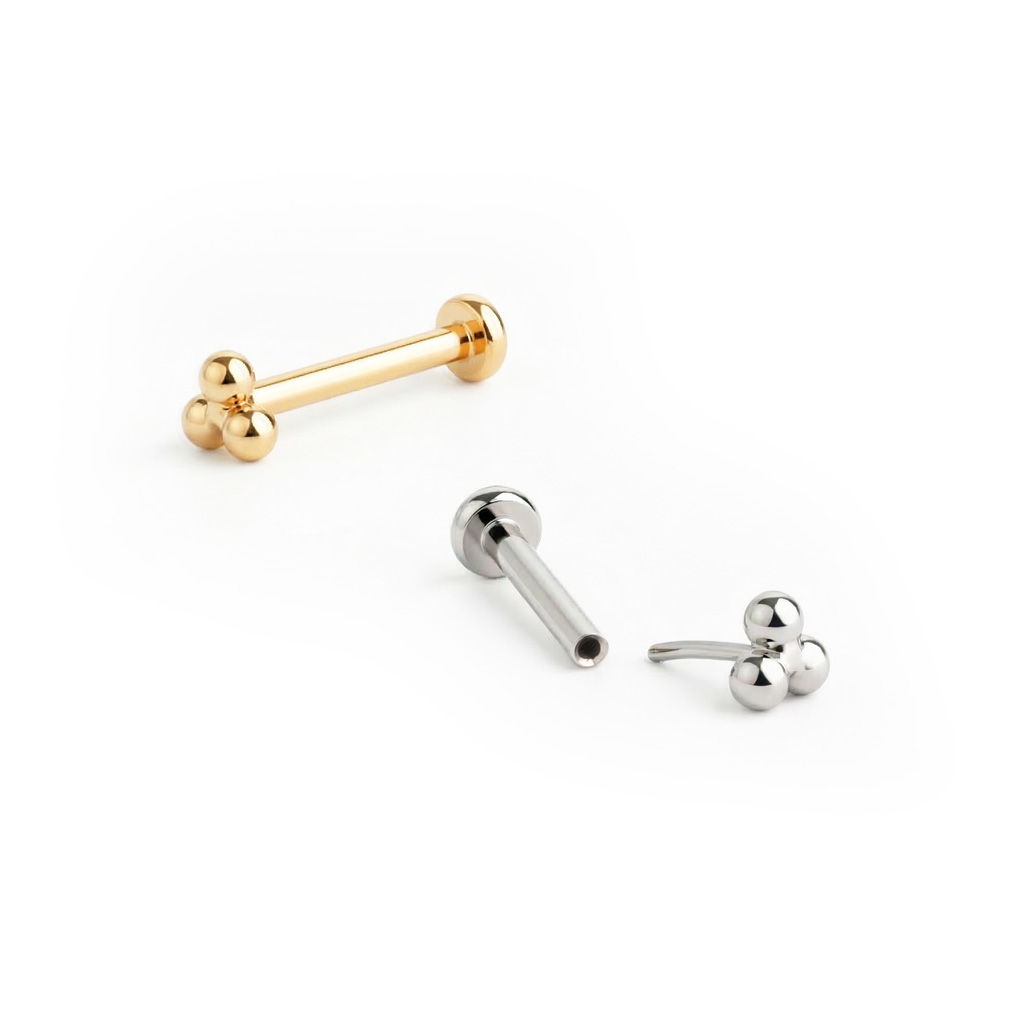 Labret push-in in titanio con top di sfere a triangolo