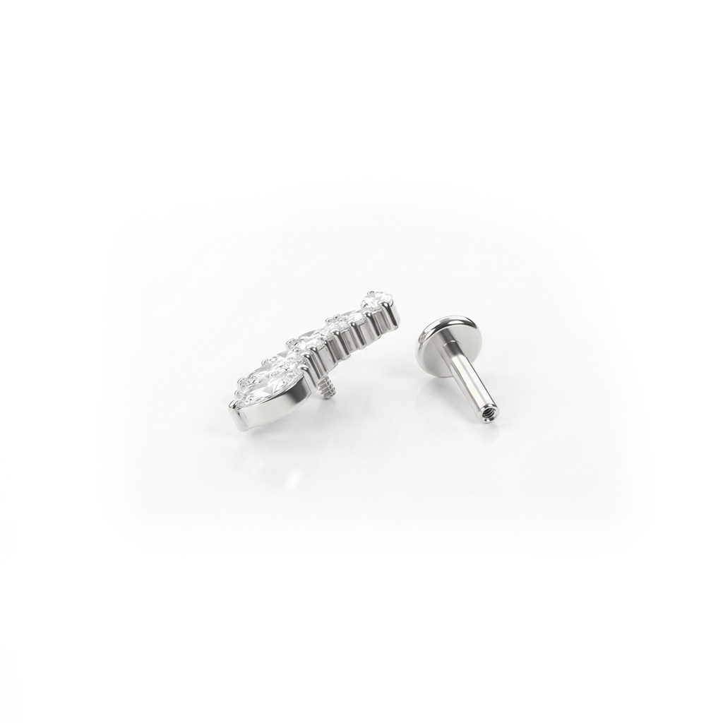 Labret in titanio con pietre rotonde e taglio marquise