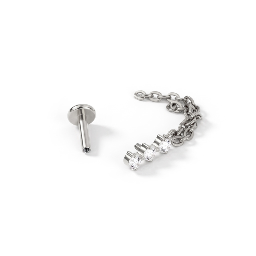 Labret in titanio con trio di pietre e doppia catenella pendente