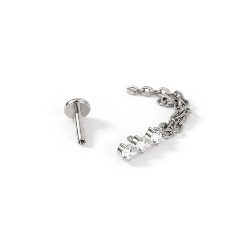 Labret in titanio con trio di pietre e doppia catenella pendente