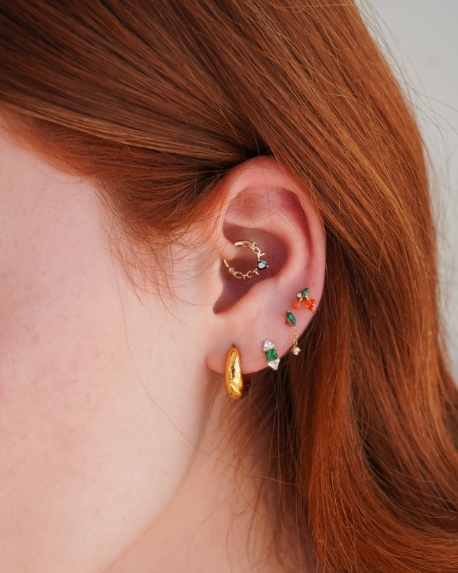 Labret con ciliegie e pietre colorate