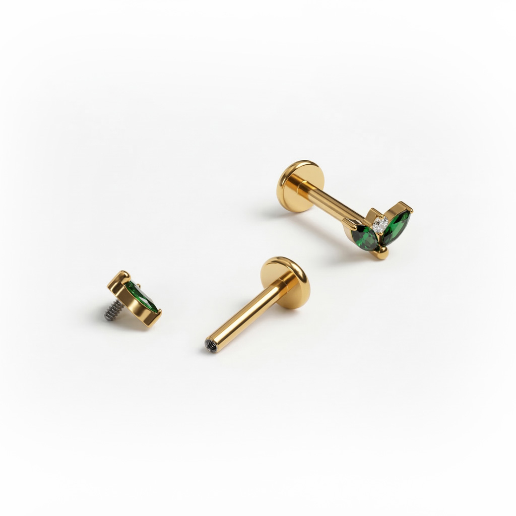Labret in titanio con coppia di pietre color smeraldo