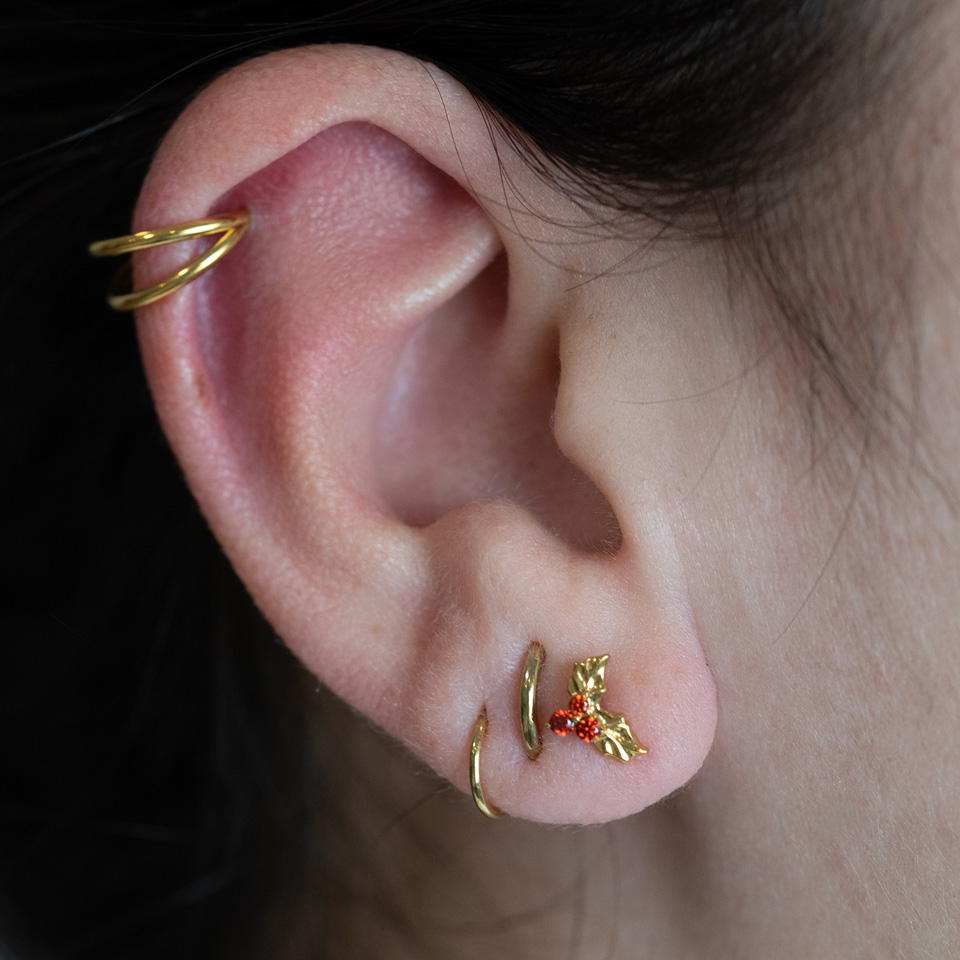 Labret in titanio con foglie natalizie